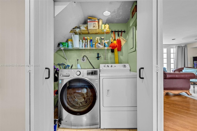 7619 SW 102nd Pl, Miami, FL 33173 - washroom with washing machine and clothes dryer and wood finished floors