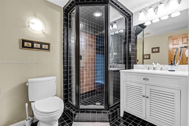 7619 SW 102nd Pl, Miami, FL 33173 - bathroom featuring toilet, vanity, tile patterned floors, and a stall shower