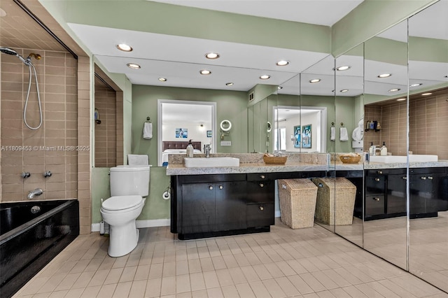 7619 SW 102nd Pl, Miami, FL 33173 - bathroom featuring recessed lighting, vanity, tile patterned floors, washtub / shower combination, and toilet