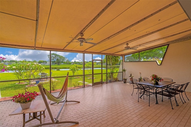 7619 SW 102nd Pl, Miami, FL 33173 - sunroom featuring a ceiling fan, a water view, and outdoor dining space