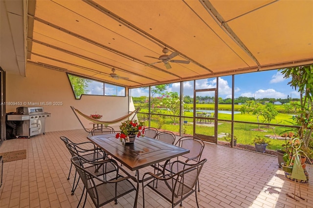 7619 SW 102nd Pl, Miami, FL 33173 - sunroom / solarium featuring ceiling fan, a water view, and outdoor dining space