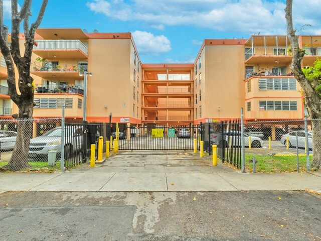 1890 W 56th St Unit 1307, Hialeah, FL 33012 - view of apartment building / complex featuring parking