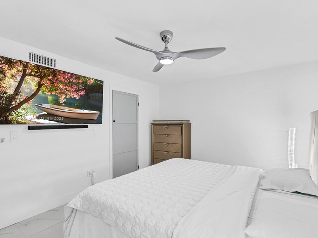 1890 W 56th St Unit 1307, Hialeah, FL 33012 - bedroom featuring marble finish flooring and a ceiling fan