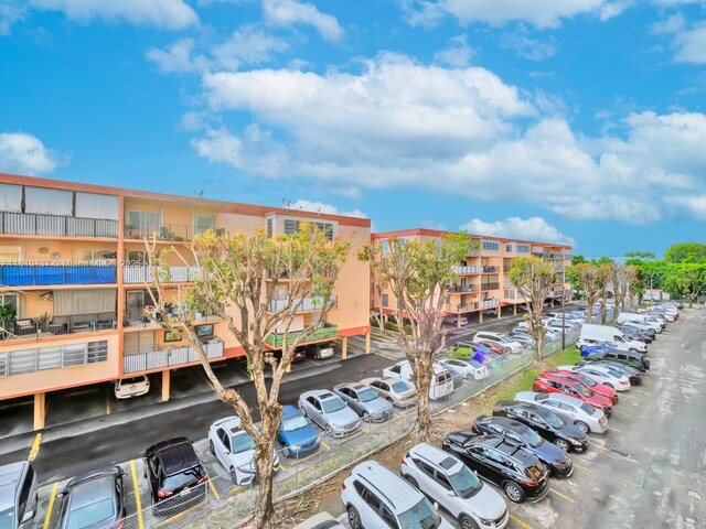 1890 W 56th St Unit 1307, Hialeah, FL 33012 - view of apartment building / complex featuring uncovered parking