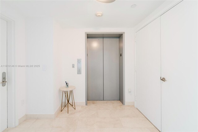1331 Brickell Bay Dr Unit 2805, Miami, FL 33131 - corridor with elevator and baseboards