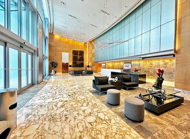 1331 Brickell Bay Dr Unit 2805, Miami, FL 33131 - building lobby featuring a high ceiling and wooden walls