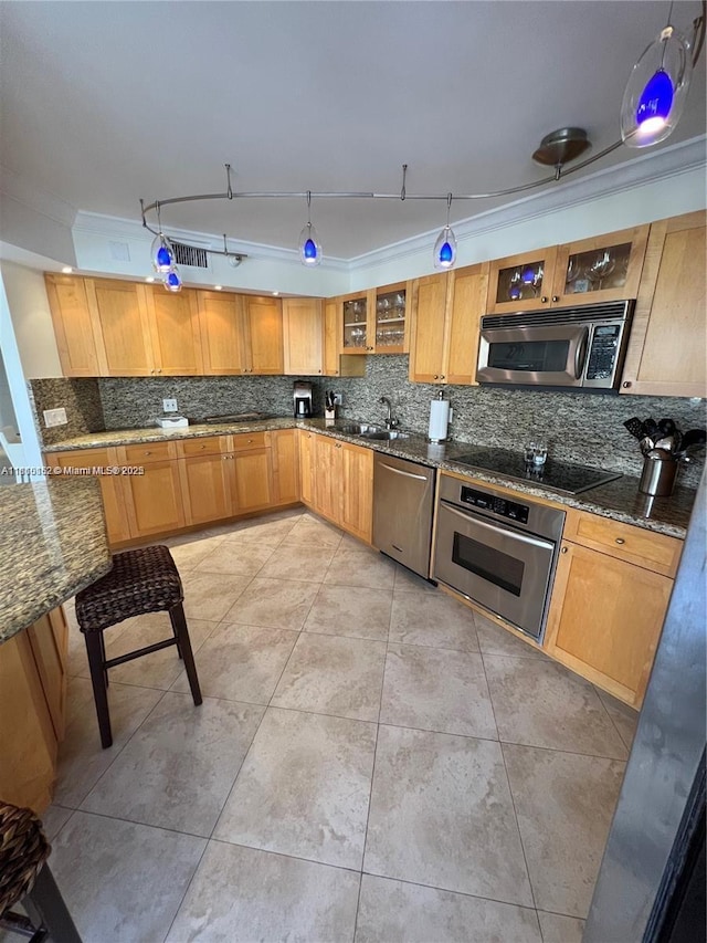 15645 Collins Ave Unit 301, Sunny Isles Beach, FL 33160 - kitchen with stainless steel appliances, tasteful backsplash, dark stone countertops, and glass insert cabinets