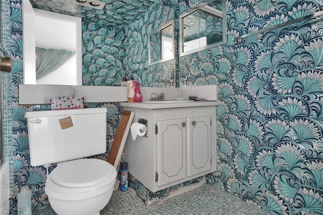 182 Westbury J 182, Deerfield Beach, FL 33442 - bathroom with wallpapered walls, toilet, and vanity