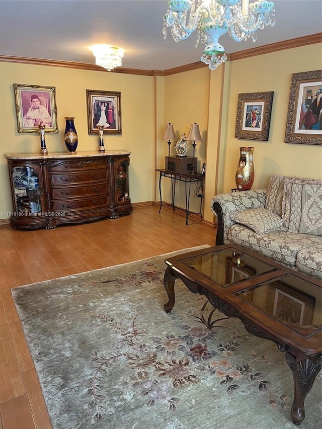 3551 NE 169th St Unit 301, North Miami Beach, FL 33160 - living area with wood finished floors, ornamental molding, and a chandelier