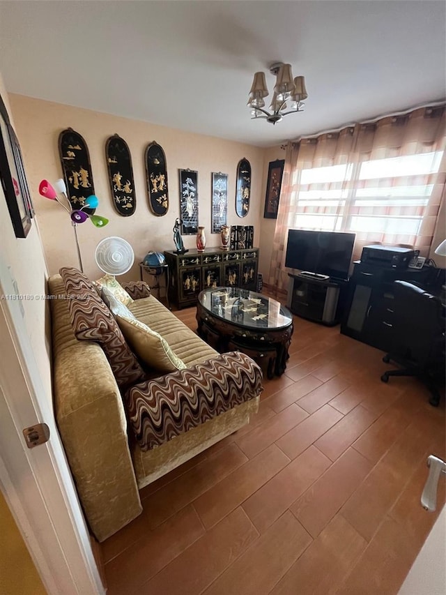 3551 NE 169th St Unit 301, North Miami Beach, FL 33160 - living room with a chandelier, a desk, and wood finished floors