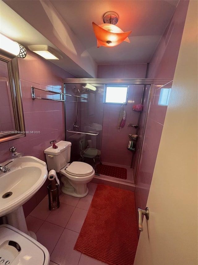 3551 NE 169th St Unit 301, North Miami Beach, FL 33160 - full bathroom featuring a shower stall and tile patterned flooring