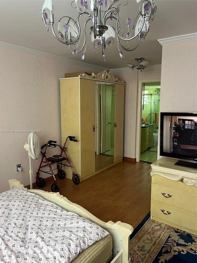 3551 NE 169th St Unit 301, North Miami Beach, FL 33160 - bedroom with ornamental molding, wood finished floors, a chandelier, ensuite bathroom, and baseboards