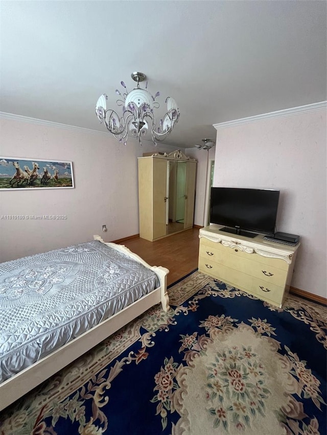 3551 NE 169th St Unit 301, North Miami Beach, FL 33160 - bedroom with crown molding and a chandelier