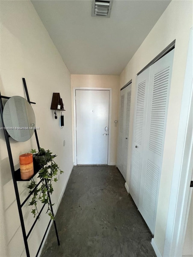 133 NE 2nd Ave Unit 913, Miami, FL 33132 - corridor with unfinished concrete floors and baseboards