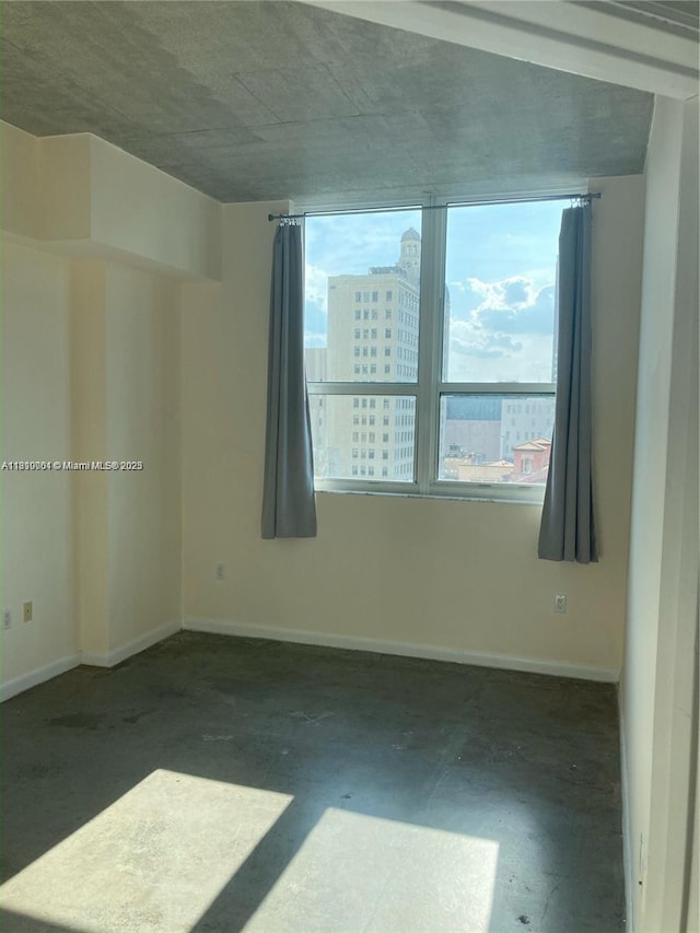 133 NE 2nd Ave Unit 913, Miami, FL 33132 - spare room featuring baseboards and a city view