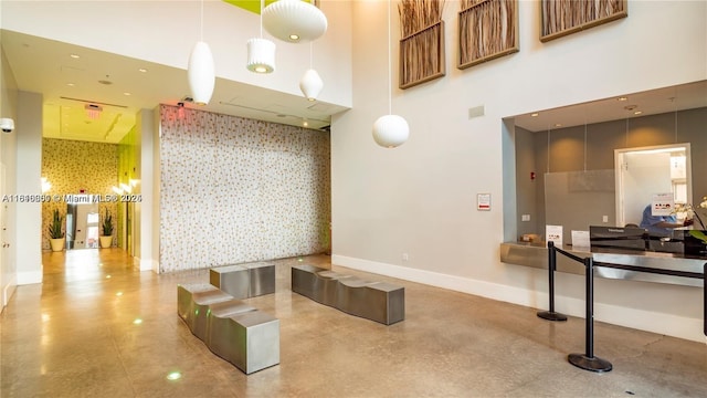 133 NE 2nd Ave Unit 913, Miami, FL 33132 - community lobby featuring wallpapered walls and a towering ceiling