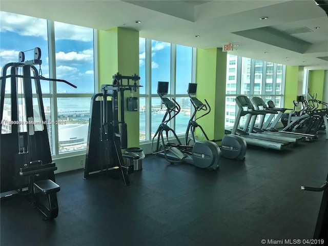 133 NE 2nd Ave Unit 913, Miami, FL 33132 - exercise room featuring plenty of natural light and a water view