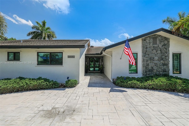 14680 SW 107th Ter, Miami, FL 33186 - doorway to property featuring stucco siding and french doors