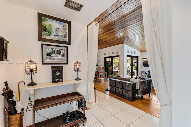 14680 SW 107th Ter, Miami, FL 33186 - hall featuring wooden ceiling, light tile patterned floors, and french doors