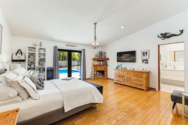 14680 SW 107th Ter, Miami, FL 33186 - bedroom with access to outside, a textured ceiling, vaulted ceiling, light wood finished floors, and ensuite bathroom