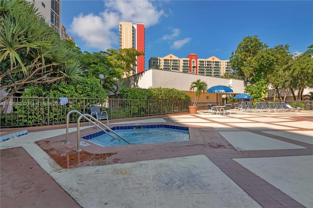 17021 N Bay Rd Unit 329, Sunny Isles Beach, FL 33160 - view of pool featuring a hot tub and a patio
