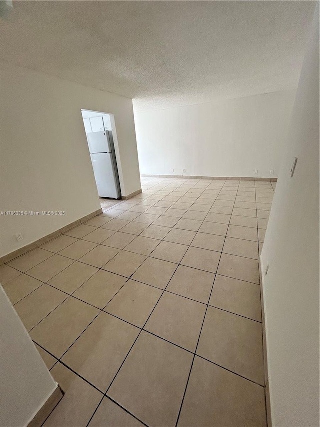 17021 N Bay Rd Unit 329, Sunny Isles Beach, FL 33160 - empty room with light tile patterned floors and a textured ceiling