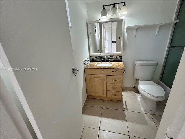 17021 N Bay Rd Unit 329, Sunny Isles Beach, FL 33160 - full bath with toilet, vanity, tasteful backsplash, tile patterned floors, and a shower with door