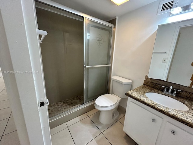 17021 N Bay Rd Unit 329, Sunny Isles Beach, FL 33160 - bathroom with toilet, vanity, a stall shower, and tile patterned floors