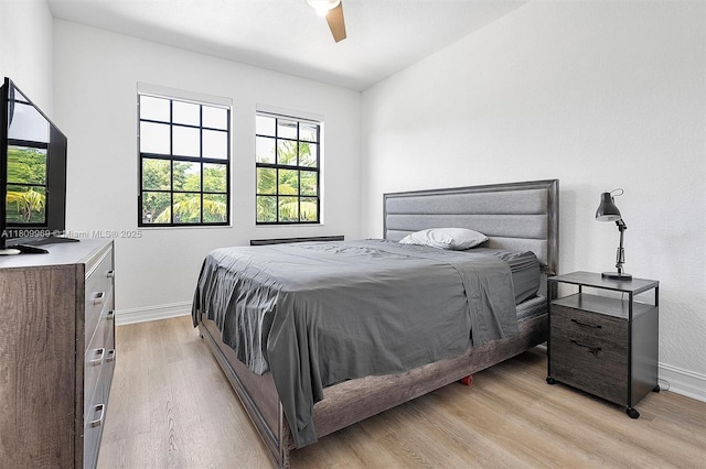 1403 SW 113th Ave, Pembroke Pines, FL 33025 - bedroom featuring baseboards, light wood-type flooring, and ceiling fan