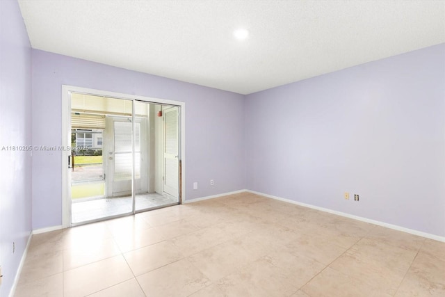 20 Lake Vista Trl Unit 107, Port St Lucie, FL 34952 - empty room featuring baseboards and light tile patterned floors