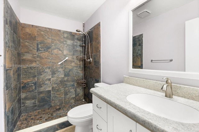 20 Lake Vista Trl Unit 107, Port St Lucie, FL 34952 - full bathroom featuring vanity, toilet, and a tile shower