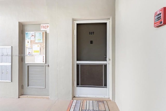 20 Lake Vista Trl Unit 107, Port St Lucie, FL 34952 - view of exterior entry with stucco siding