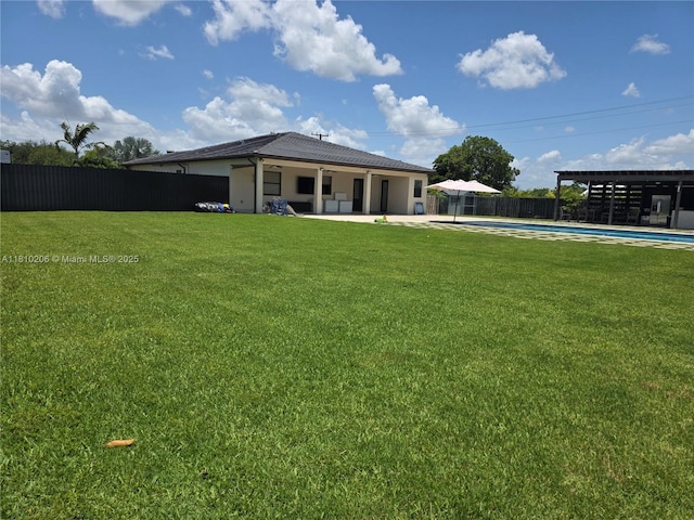 21305 SW 177th Ct, Miami, FL 33187 - rear view of house featuring a fenced backyard, a patio, and stucco siding