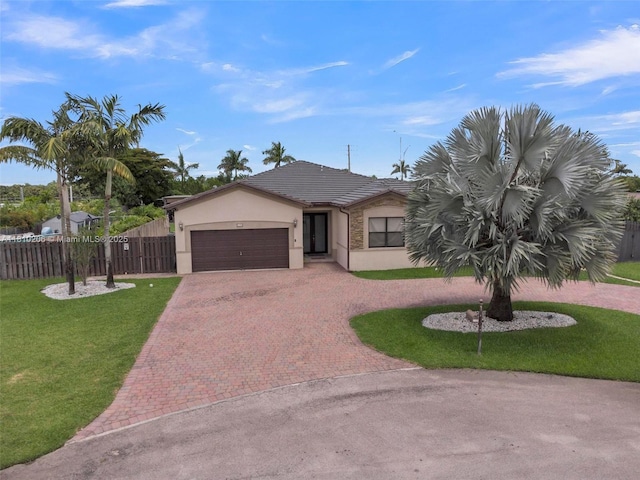 21305 SW 177th Ct, Miami, FL 33187 - single story home with decorative driveway, stucco siding, an attached garage, and a tiled roof