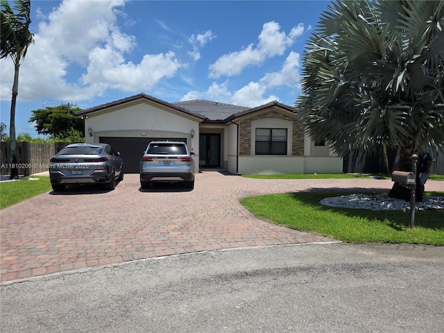 21305 SW 177th Ct, Miami, FL 33187 - ranch-style home featuring decorative driveway, a garage, stucco siding, and stone siding