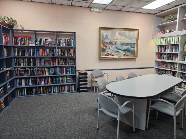 900 Colony Point Cir Unit 505, Pembroke Pines, FL 33026 - carpeted home office with bookshelves