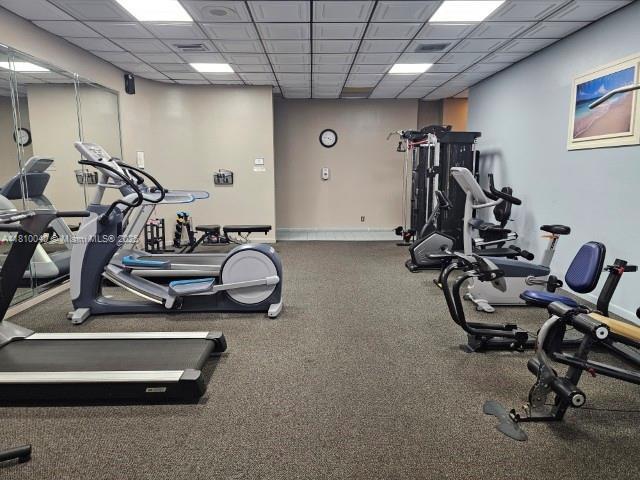 900 Colony Point Cir Unit 505, Pembroke Pines, FL 33026 - exercise room featuring a paneled ceiling and baseboards