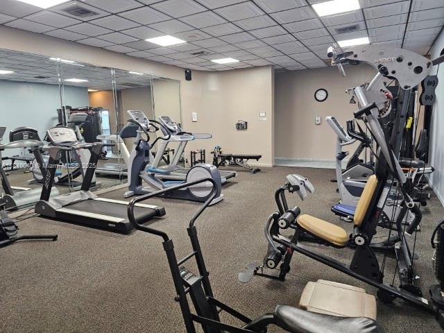 900 Colony Point Cir Unit 505, Pembroke Pines, FL 33026 - workout area featuring a drop ceiling and baseboards