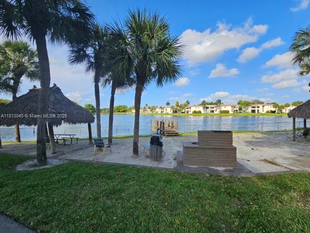 900 Colony Point Cir Unit 505, Pembroke Pines, FL 33026 - view of home's community with a lawn and a water view