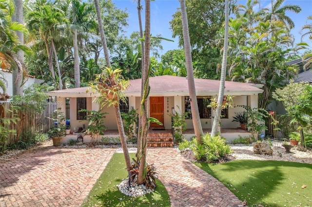 2810 Crystal Ct, Miami, FL 33133 - single story home featuring stucco siding and a porch