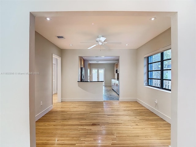 2810 Crystal Ct, Miami, FL 33133 - spare room featuring light wood-style flooring, baseboards, a ceiling fan, and recessed lighting