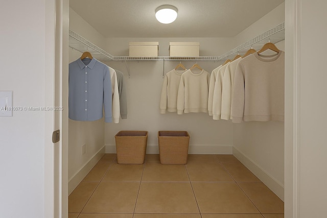 4660 NW 79th Ave Unit 1C, Doral, FL 33166 - walk in closet with tile patterned flooring