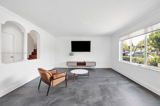 1884 Galleon St Unit 1, North Bay Village, FL 33141 - living area featuring concrete floors, ornamental molding, baseboards, and decorative columns