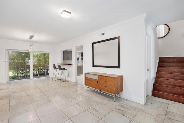 1884 Galleon St Unit 1, North Bay Village, FL 33141 - spare room with stairs, ornamental molding, and baseboards