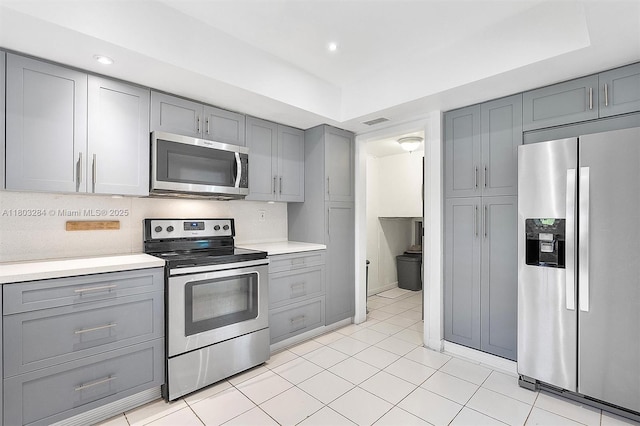 1884 Galleon St Unit 1, North Bay Village, FL 33141 - kitchen featuring stainless steel appliances, gray cabinets, light countertops, recessed lighting, and light tile patterned flooring