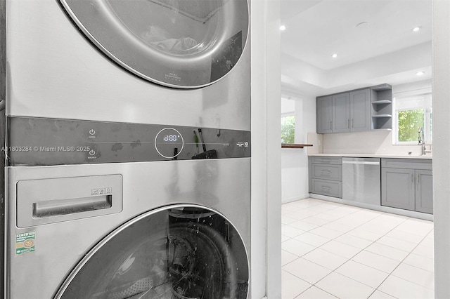 1884 Galleon St Unit 1, North Bay Village, FL 33141 - washroom featuring stacked washer and clothes dryer, plenty of natural light, recessed lighting, and light tile patterned floors