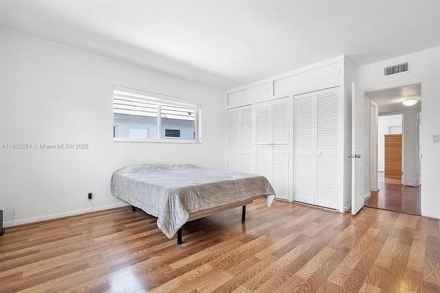 1884 Galleon St Unit 1, North Bay Village, FL 33141 - bedroom featuring light wood-style floors, baseboards, and crown molding