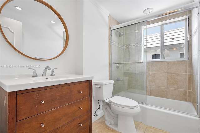 1884 Galleon St Unit 1, North Bay Village, FL 33141 - bathroom featuring vanity, toilet, tile patterned floors, bath / shower combo with glass door, and ornamental molding