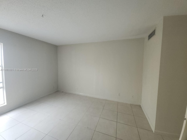 1500 N Congress Ave Unit B53, West Palm Beach, FL 33401 - spare room featuring a textured ceiling