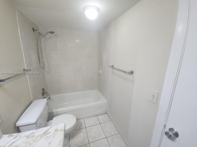 1500 N Congress Ave Unit B53, West Palm Beach, FL 33401 - bathroom featuring toilet, tile patterned floors, and shower / washtub combination